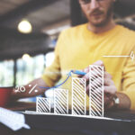 closeup-man-writing-arrow-up-graph-increase-1.jpg